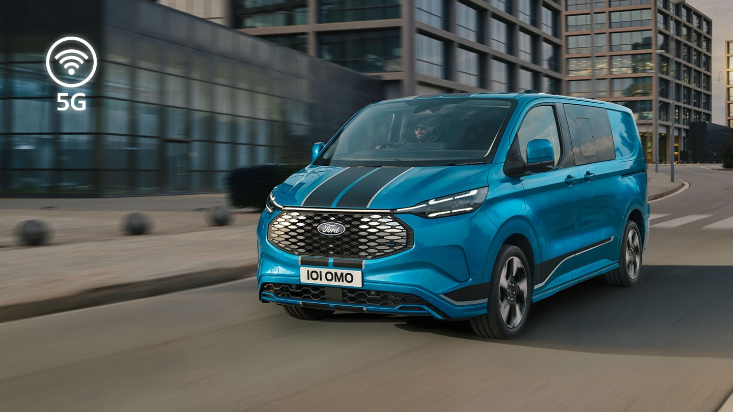 ford e_transit_custom eu Large_Card_01_V710_Sport 16x9 1440x810 front side view blue v710 driving